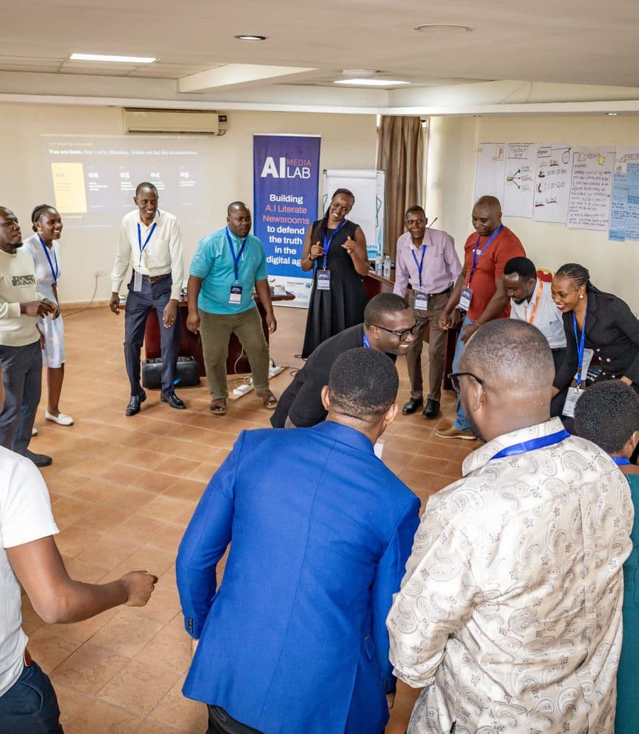Educators standing in a wide circle during a convening at the AI Media Lab.